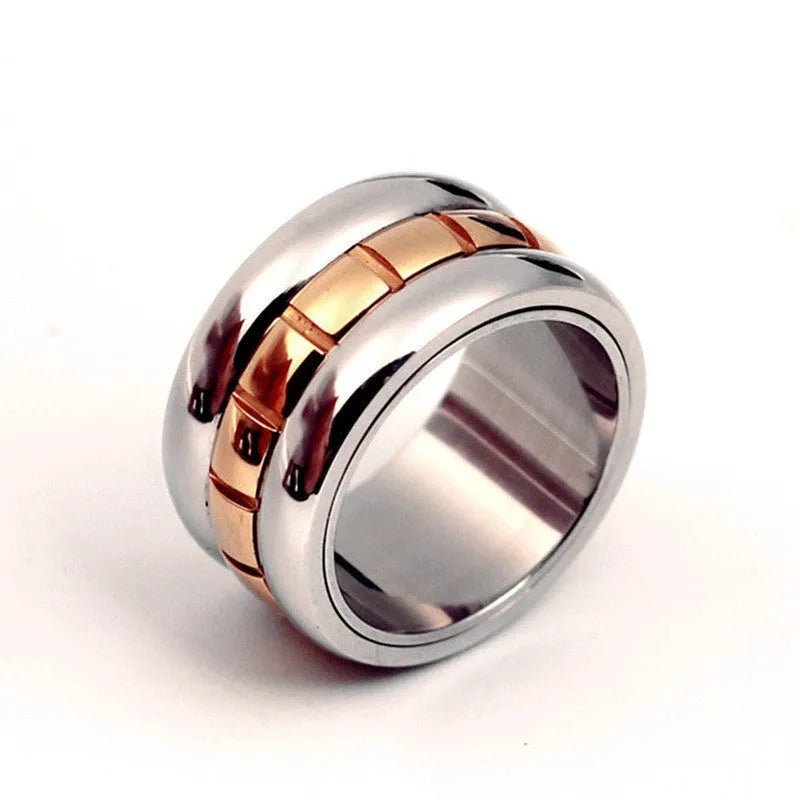 Gold ultra-wide titanium steel men's ring with a rotatable tail component on a finger.