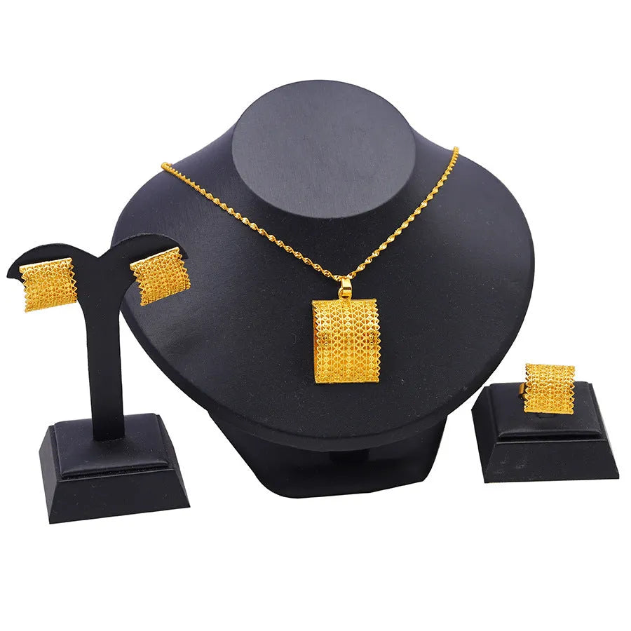 Gold colour bridal jewellery set with necklace, earrings and ring combination