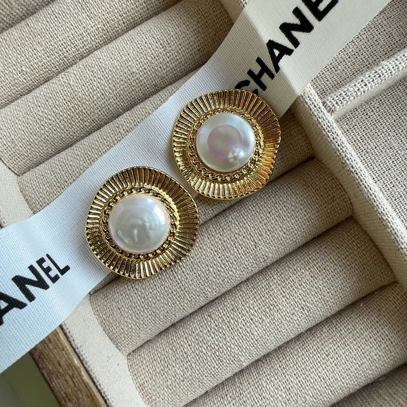 Women's round hoop earrings in French retro style with electroplated gold metal construction providing a simple, circular design for everyday wear and special occasions.