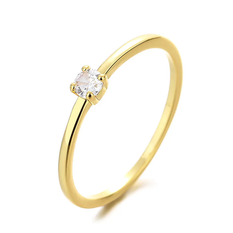 Twin Style copper geometric circle ring with a single diamond, shown in blue, green, red, or white.
