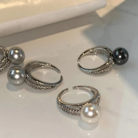 Black Pearl geometric open-ended adjustable copper ring on a woman's finger, showing angular design.