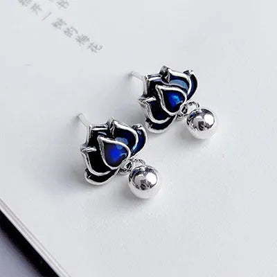 Blue Lotus Earrings with 1.2cm width lotus flower design and seedpod tassel detail
