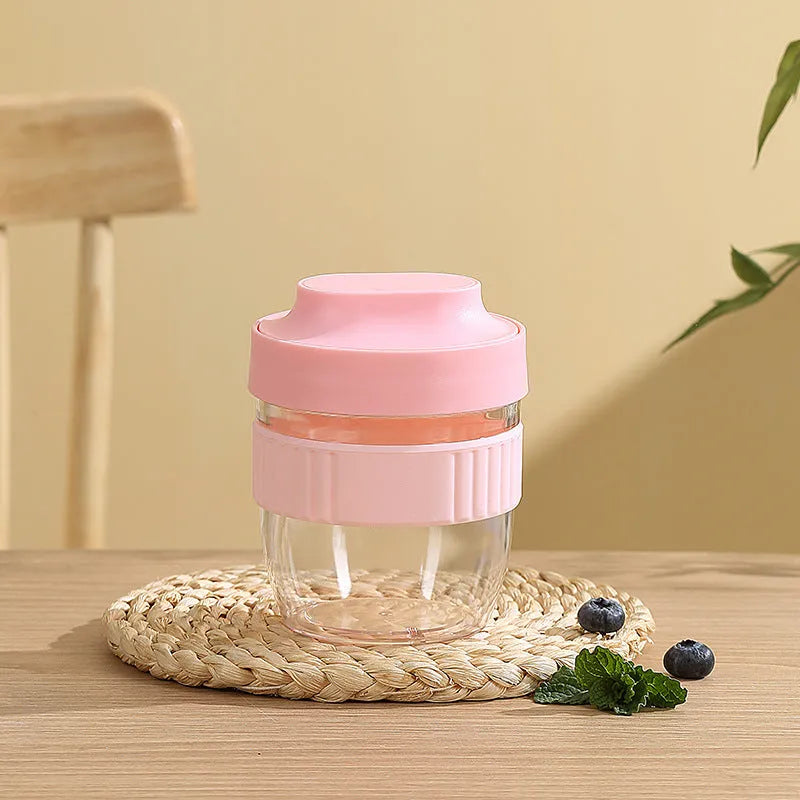 Green PP plastic salad cup with attached lid and spoon on a white background.