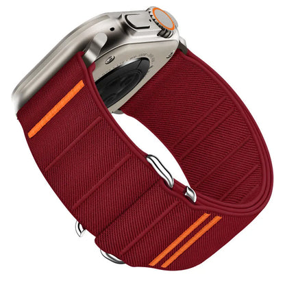 Elastic nylon Apple Watch band in Army Green with stainless steel buckle, shown on a wrist.