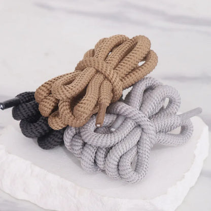 Round braided cotton shoelaces in multiple colours showing width and length options on a white background.