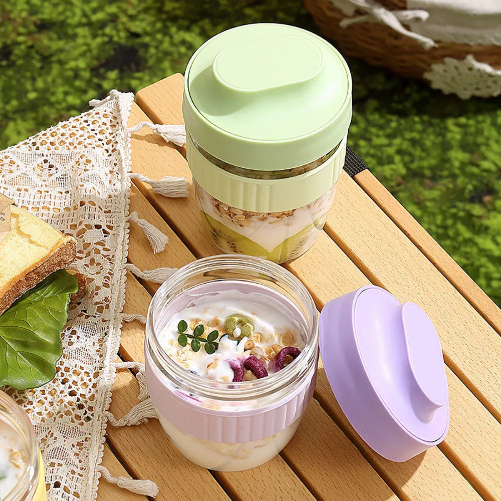Green PP plastic salad cup with attached lid and spoon on a white background.