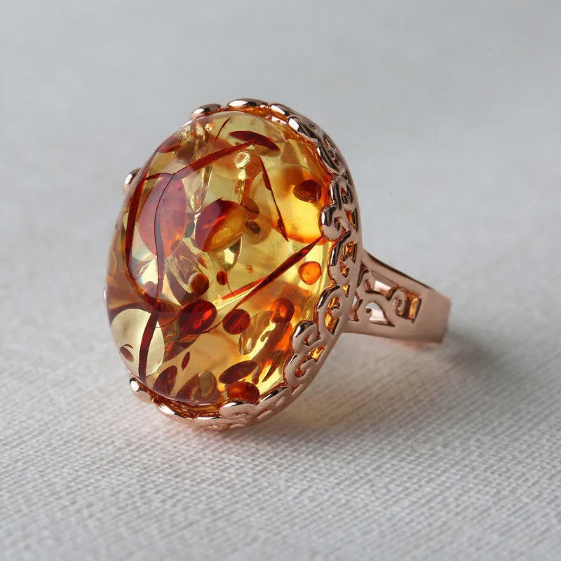 Beeswax ethnic style ring with amber centrepiece in New Amber Type A colour on alloy band
