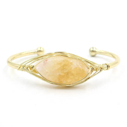Natural raw gemstone bracelet with 8mm rough crystal beads in ethnic style, shown on wrist.