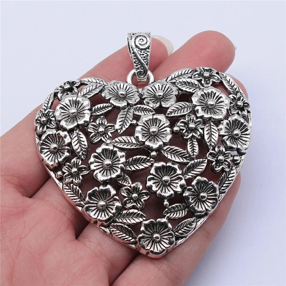 Ancient silver hollow flower love alloy pendant measuring 67mm by 58mm