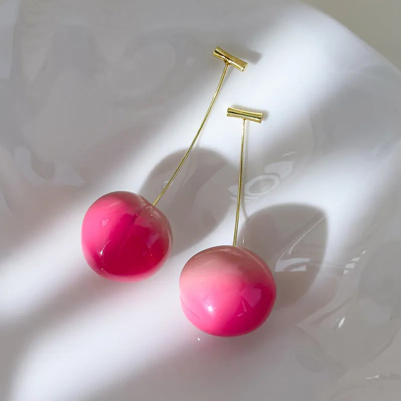 Acrylic peach-shaped earrings with copper posts in small and large size options