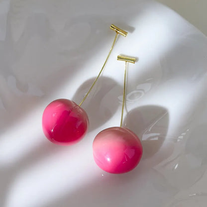 Acrylic peach-shaped earrings with copper posts in small and large size options