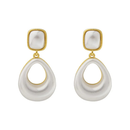 Gold-plated mabe pearl drop earrings with imitation pearl drops and office-appropriate styling