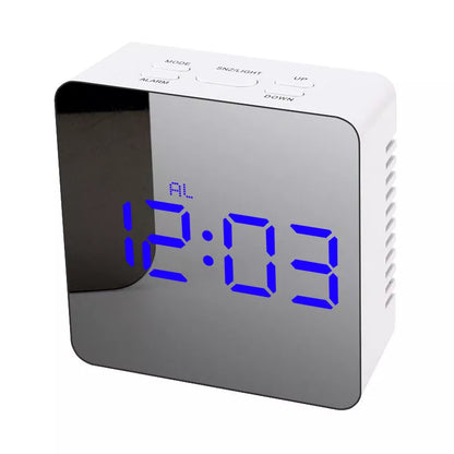 LED Digital Mirror Alarm Clock with customizable light colors on a desktop