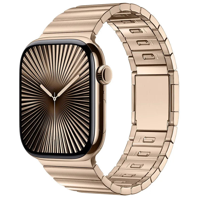 Silver stainless steel magnetic buckle strap attached to an Apple Watch on a wrist.