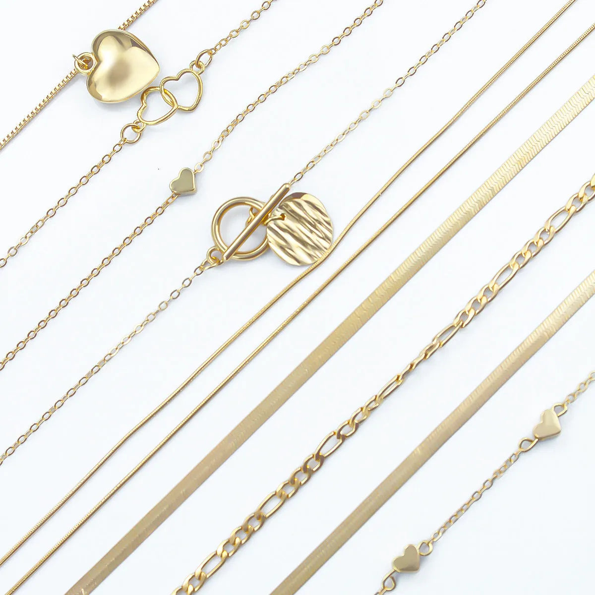 10 gold necklaces with adjustable chains from 21cm to 50cm, featuring electroplated alloy pendants on snake bone chains