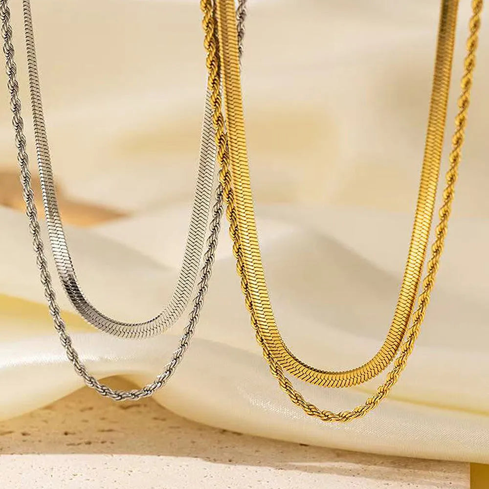 Women's adjustable double-layer twist necklace with titanium steel geometric pendant on snake bones chain, showing 21-50cm length range