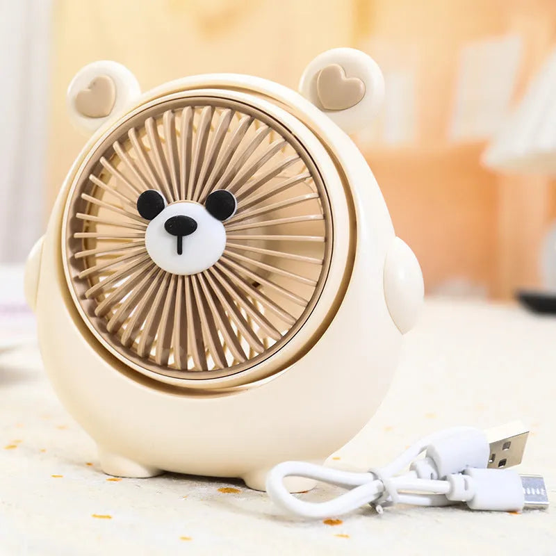 USB desktop fan with dog design showing three speed buttons and USB port, placed on a desk.