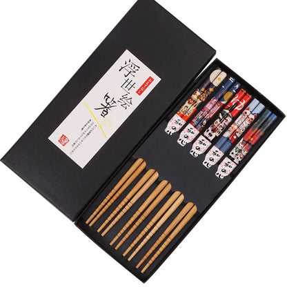 Set of five pairs of bamboo chopsticks showing lucky cat and chi ya blue pattern designs in gift box.