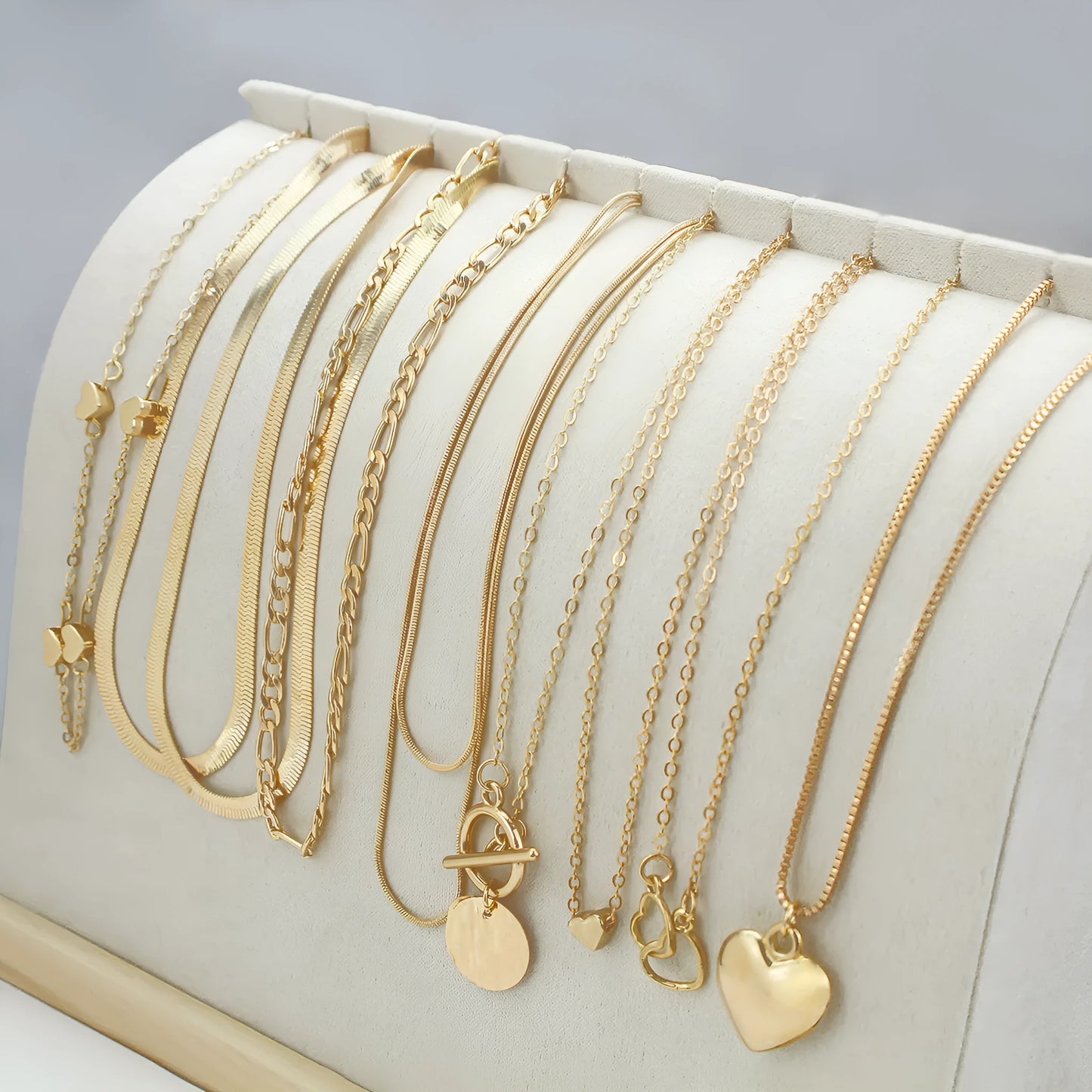 10 gold necklaces with adjustable chains from 21cm to 50cm, featuring electroplated alloy pendants on snake bone chains