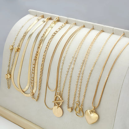 10 gold necklaces with adjustable chains from 21cm to 50cm, featuring electroplated alloy pendants on snake bone chains