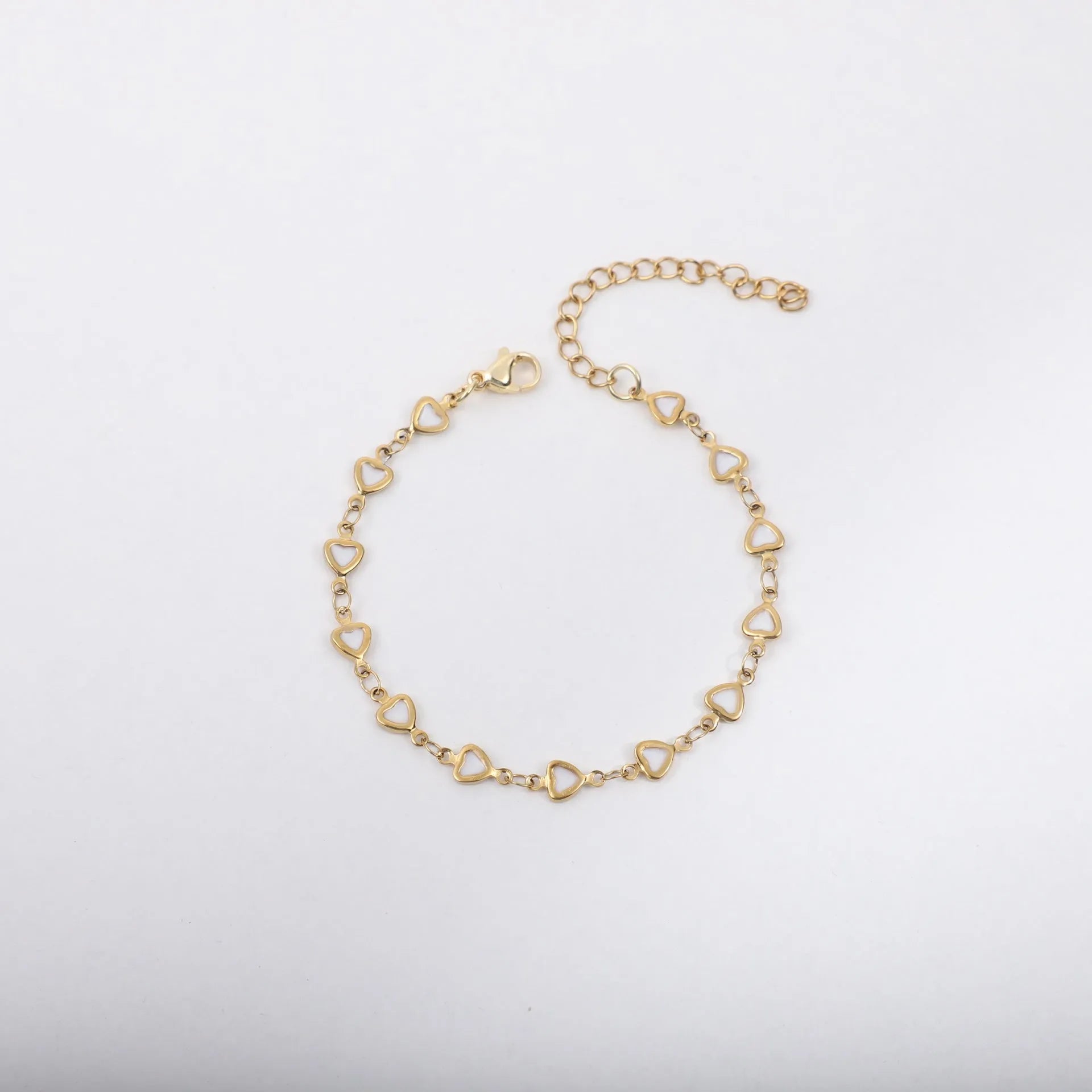 Stainless steel heart bracelet with 18K gold plating in multiple colours showing adjustable 17+5cm length