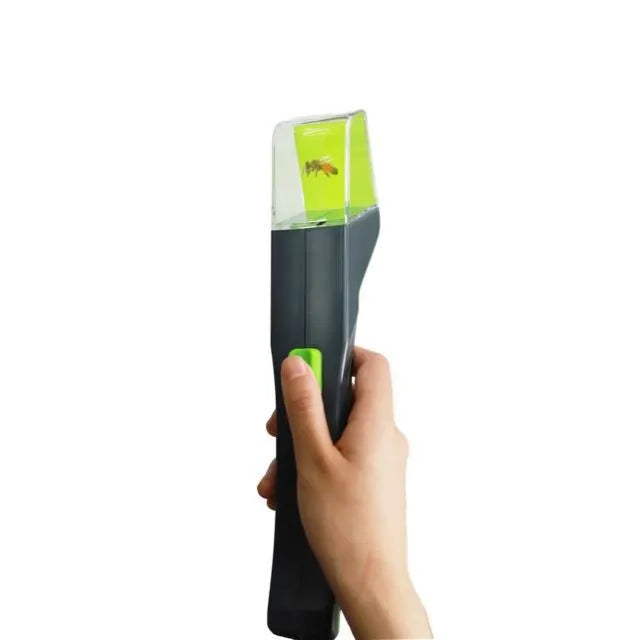 Green plastic handheld insect catcher for manual garden pest control
