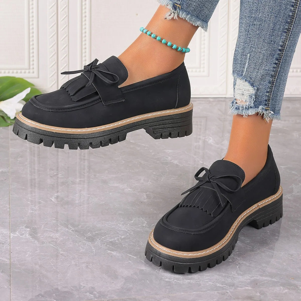 Women's black plus size loafers with tassel, bowknot, chunky heel, and rubber sole