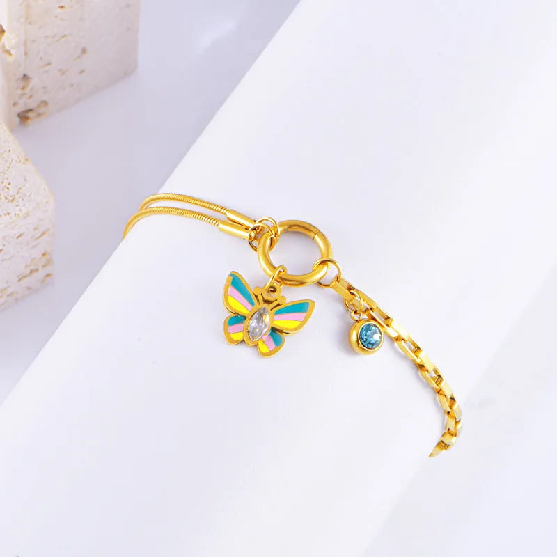 Gold titanium steel jewellery set with colourful epoxy butterfly pendant necklace and matching bracelet