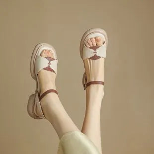 Beige women's chunky heel platform sandals with an open toe and rubber sole.