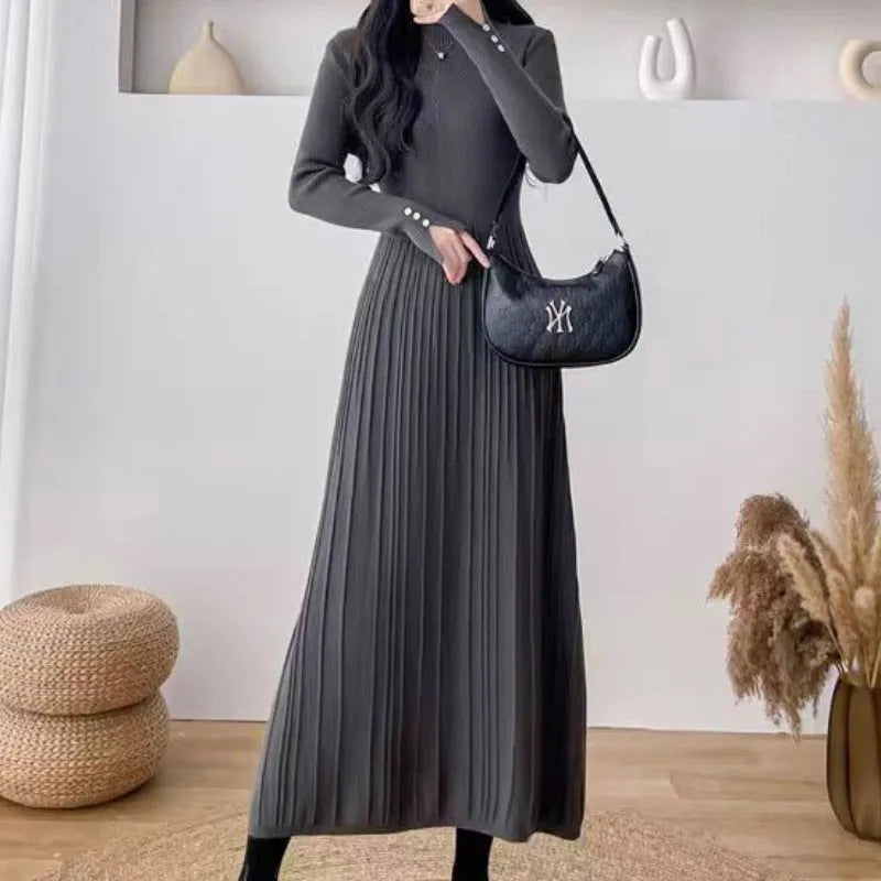 Women's high waist A-line knit skirt in a solid colour, knee-length midi style.
