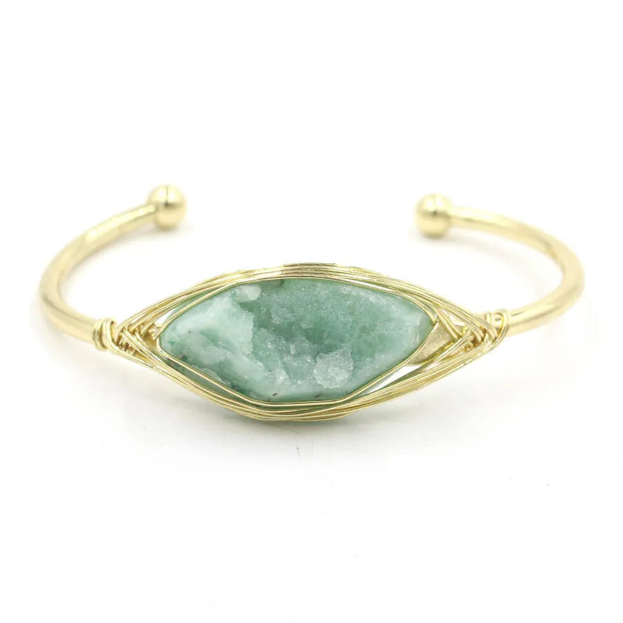 Natural raw gemstone bracelet with 8mm rough crystal beads in ethnic style, shown on wrist.