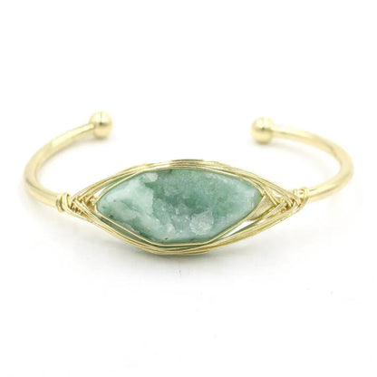 Natural raw gemstone bracelet with 8mm rough crystal beads in ethnic style, shown on wrist.