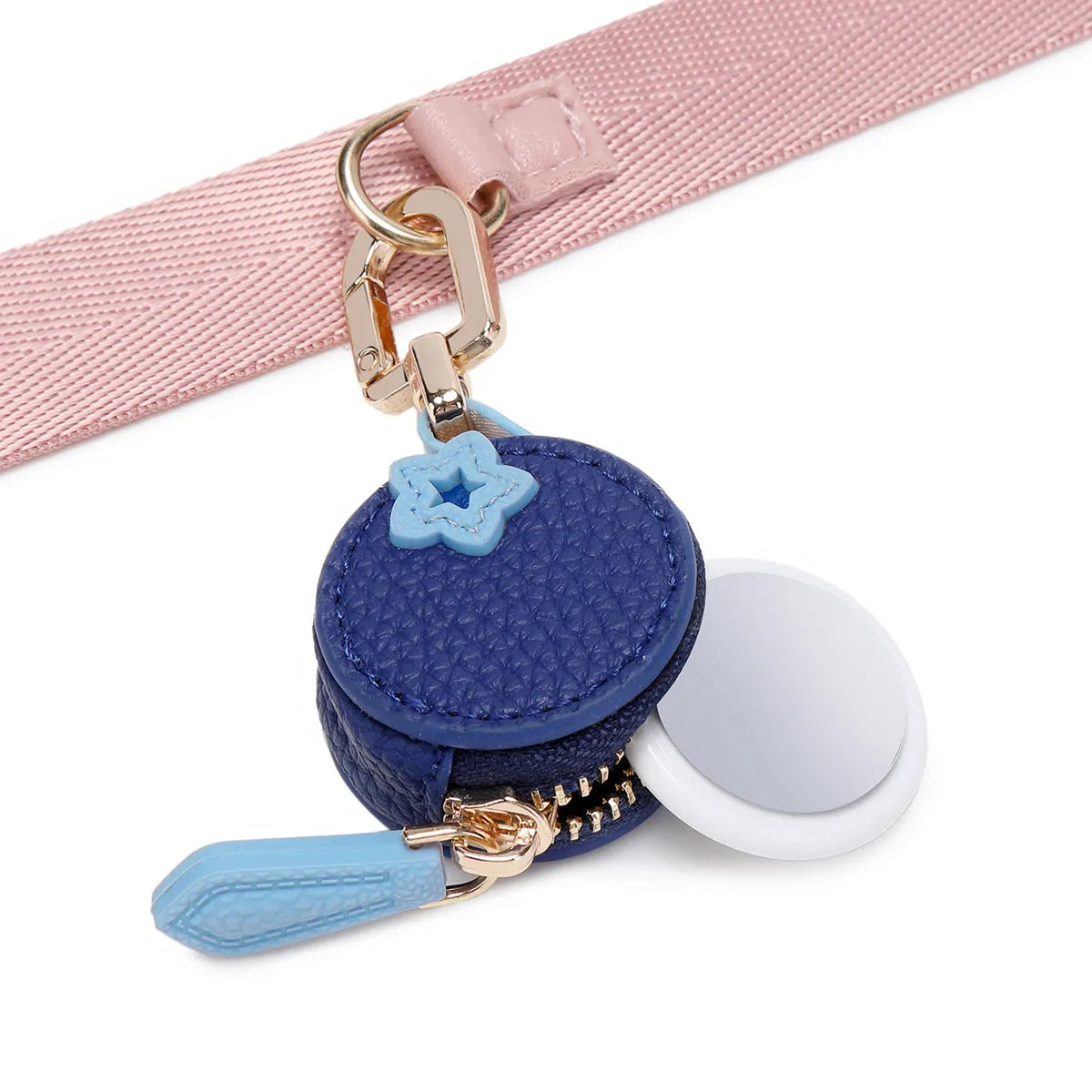 Small solid colour PU leather keychain coin bag in cherry, blueberry, or orange.