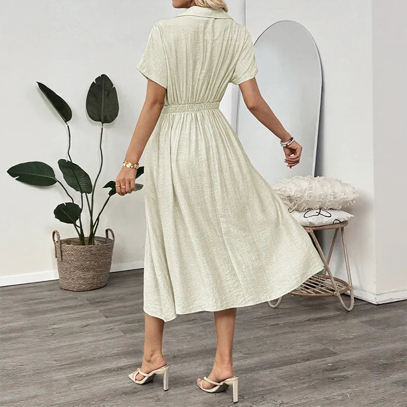 Light green women's shirt dress with lapel collar, waist tie, and pockets on a mannequin.