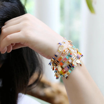 Women's handcrafted bracelet with imitation pearl and coloured glass beads in one of six colour styles.