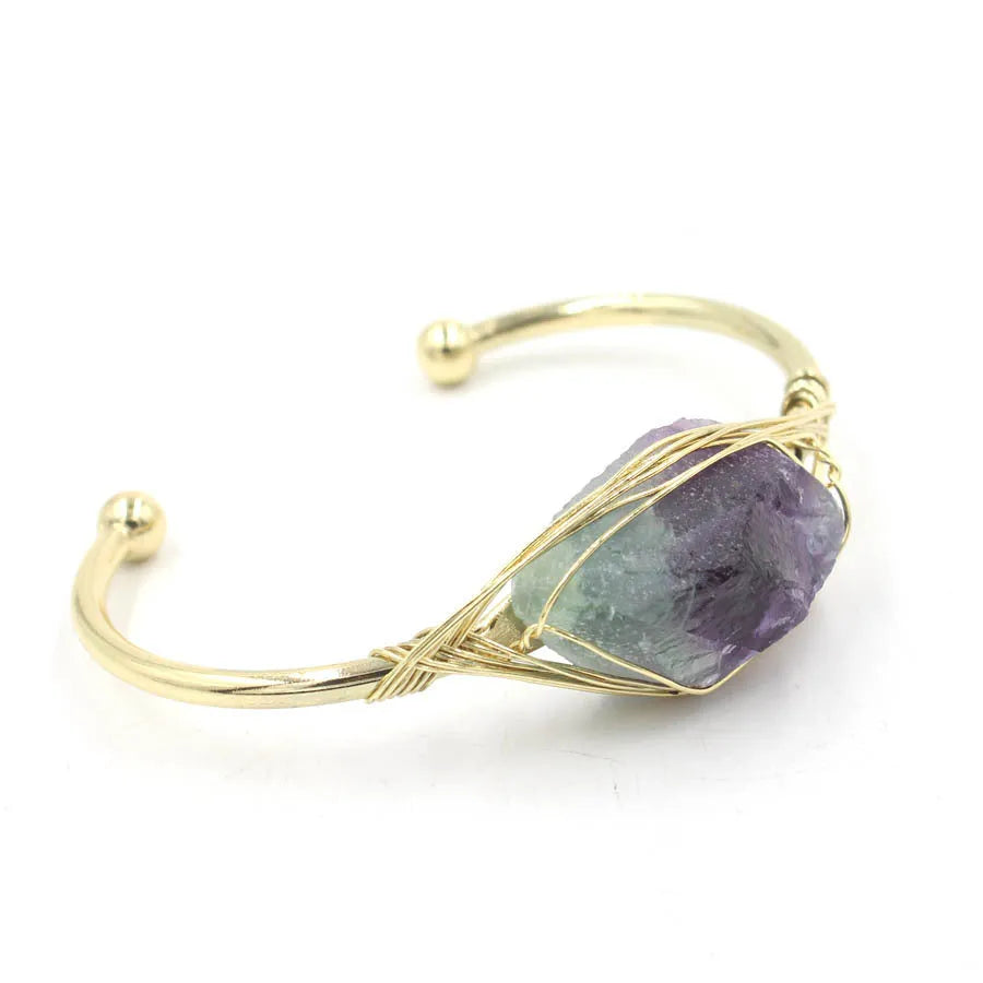 Natural raw gemstone bracelet with 8mm rough crystal beads in ethnic style, shown on wrist.