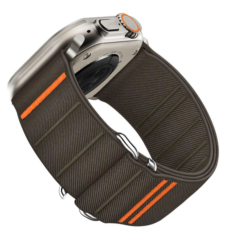 Elastic nylon Apple Watch band in Army Green with stainless steel buckle, shown on a wrist.