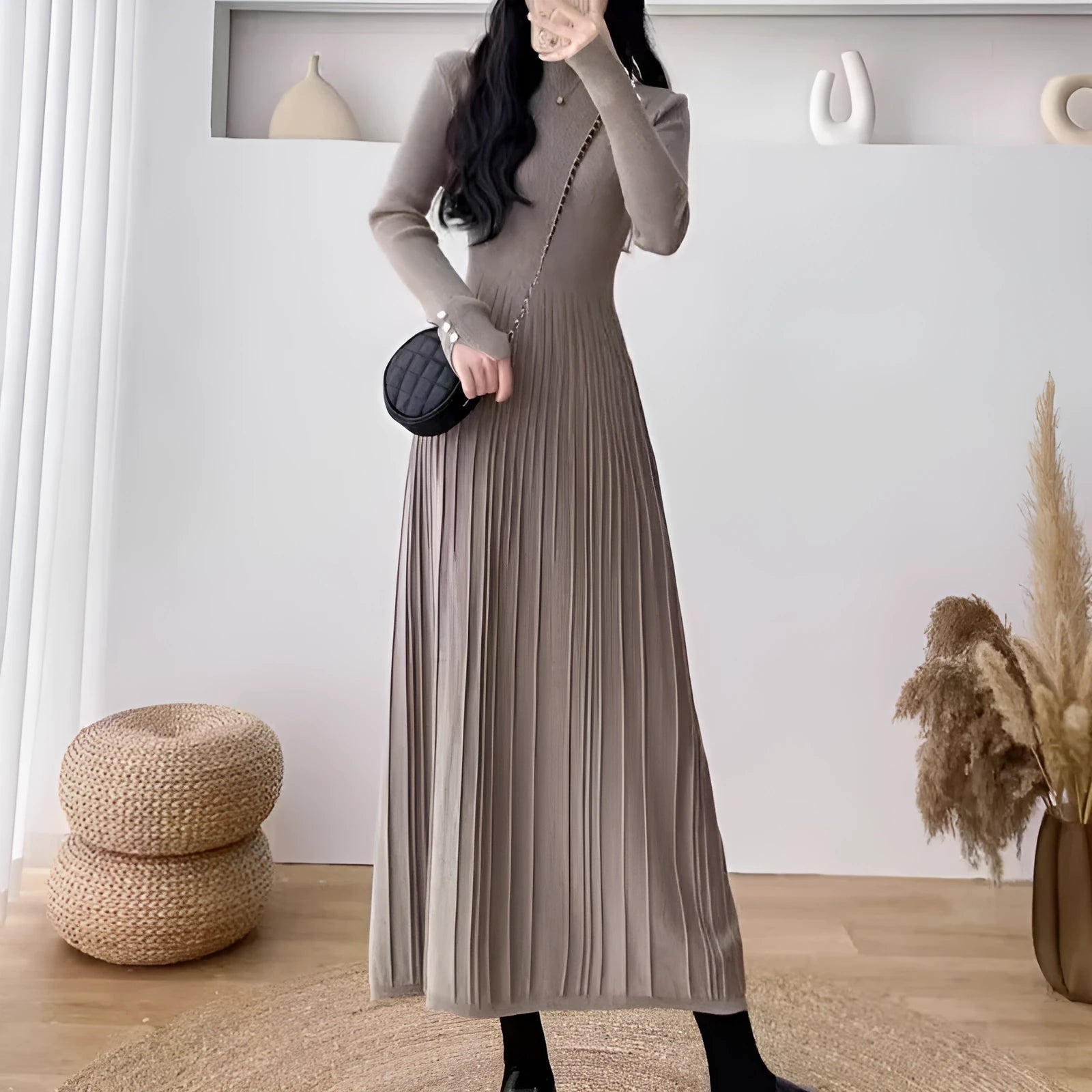 Women's high waist A-line knit skirt in a solid colour, knee-length midi style.
