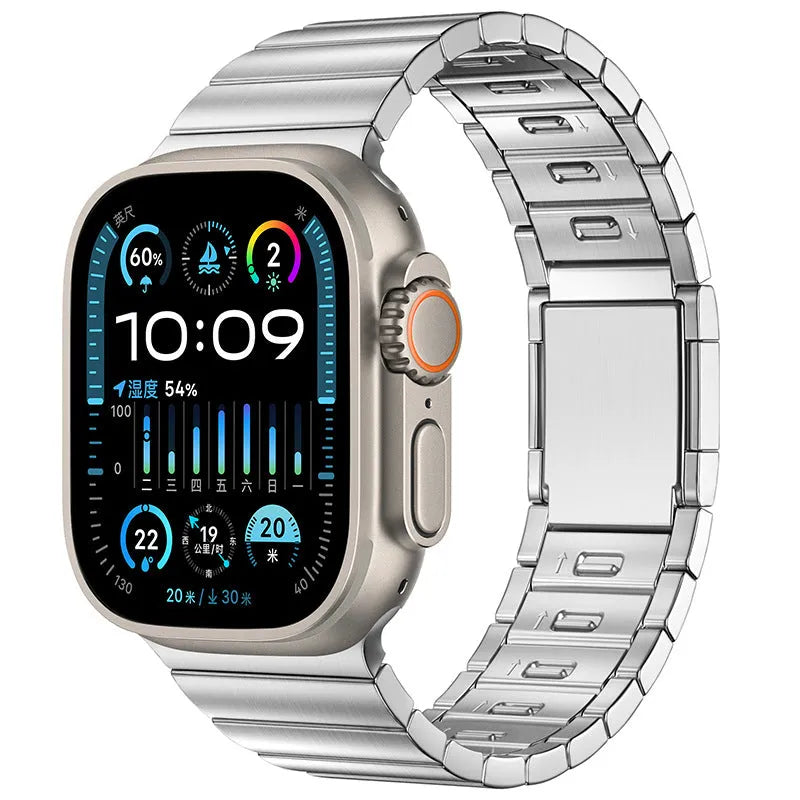 Silver stainless steel magnetic buckle strap attached to an Apple Watch on a wrist.