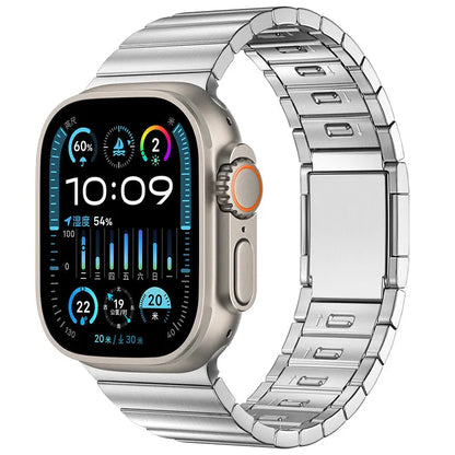 Silver stainless steel magnetic buckle strap attached to an Apple Watch on a wrist.
