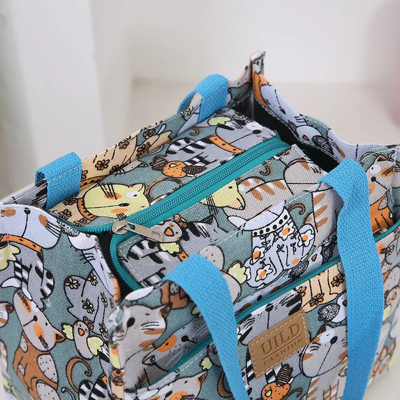 Women's portable printed canvas bag in horizontal square shape with floral design, showing reinforced base and large capacity.