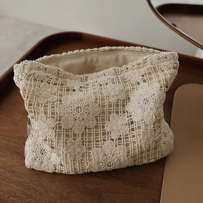 Handmade crocheted corduroy cosmetic bag with hollow flower embroidery in a rope style