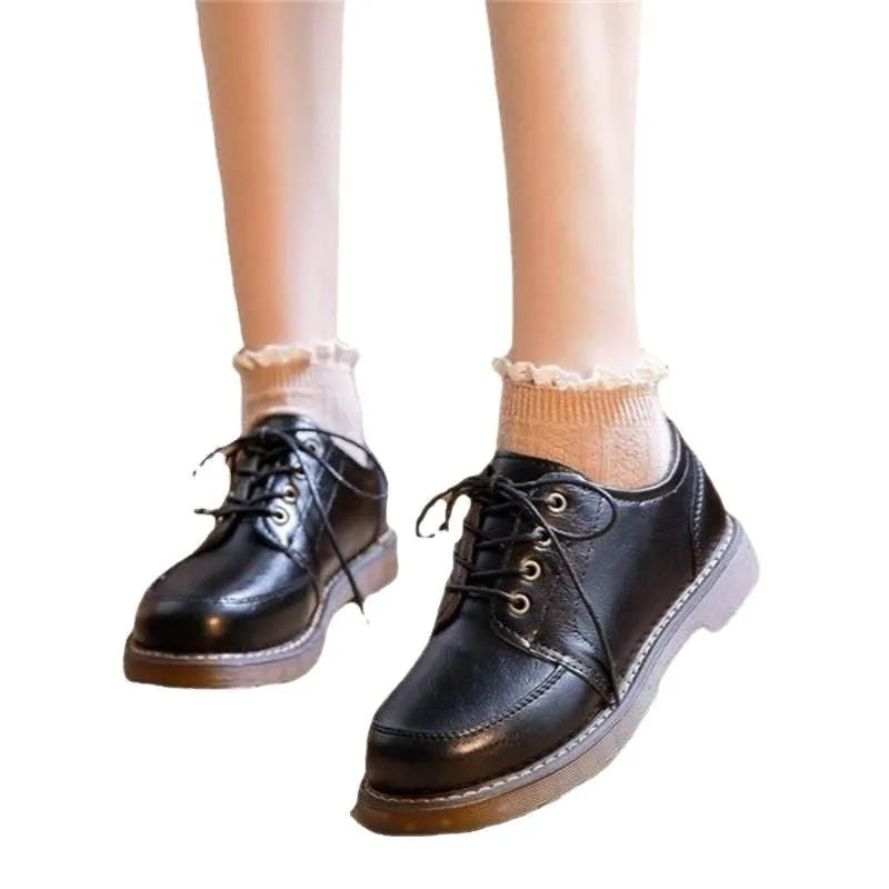 Black retro women's Mary Jane pumps with a low square heel and front lace-up.