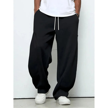 Men's solid colour casual trousers with a straight leg and elastic drawstring waist.