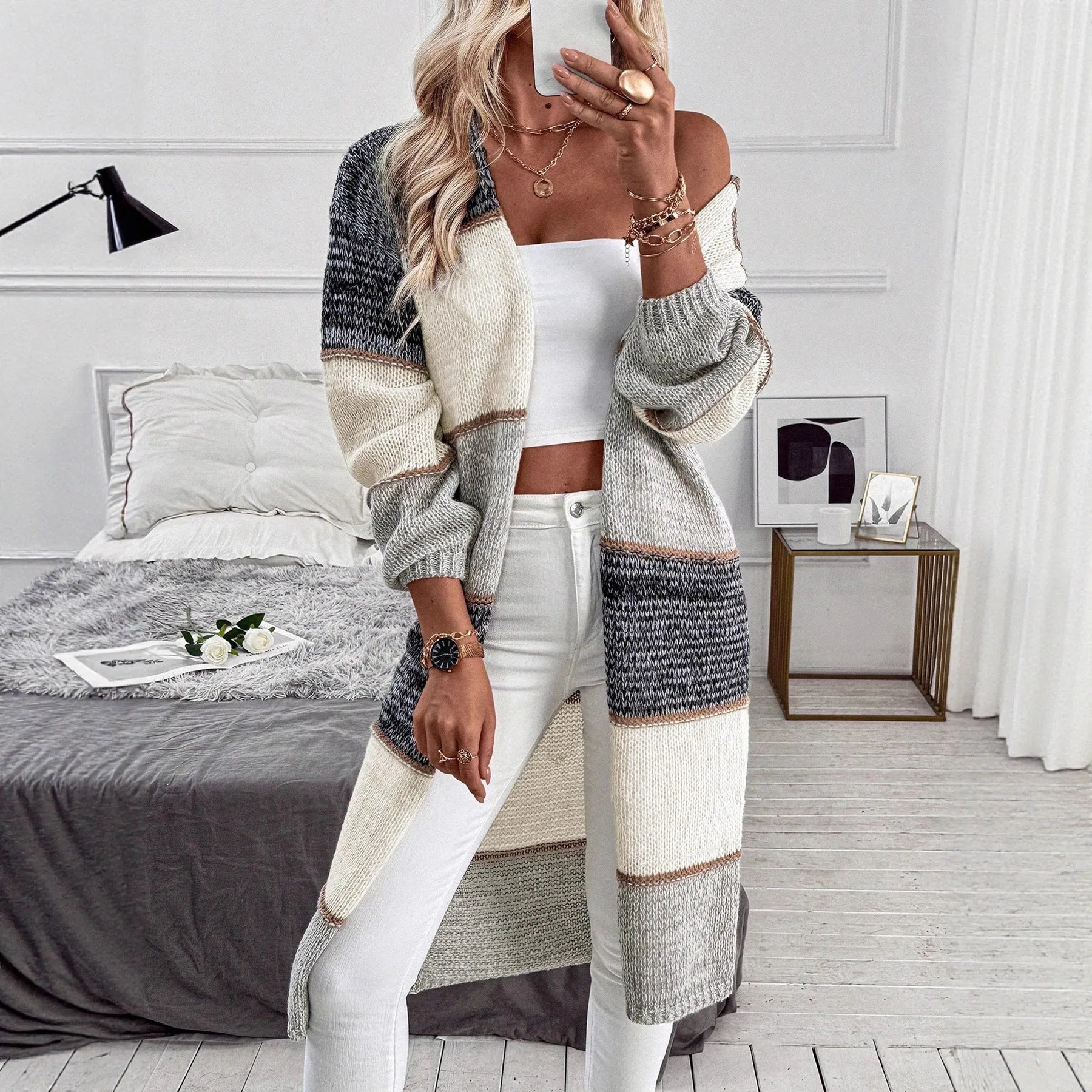 Grey striped women's knitted cardigan with long sleeves and loose fit design