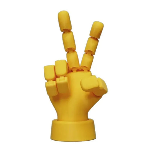 Yellow movable joint hand ornament showing articulated fingers and wrist joints