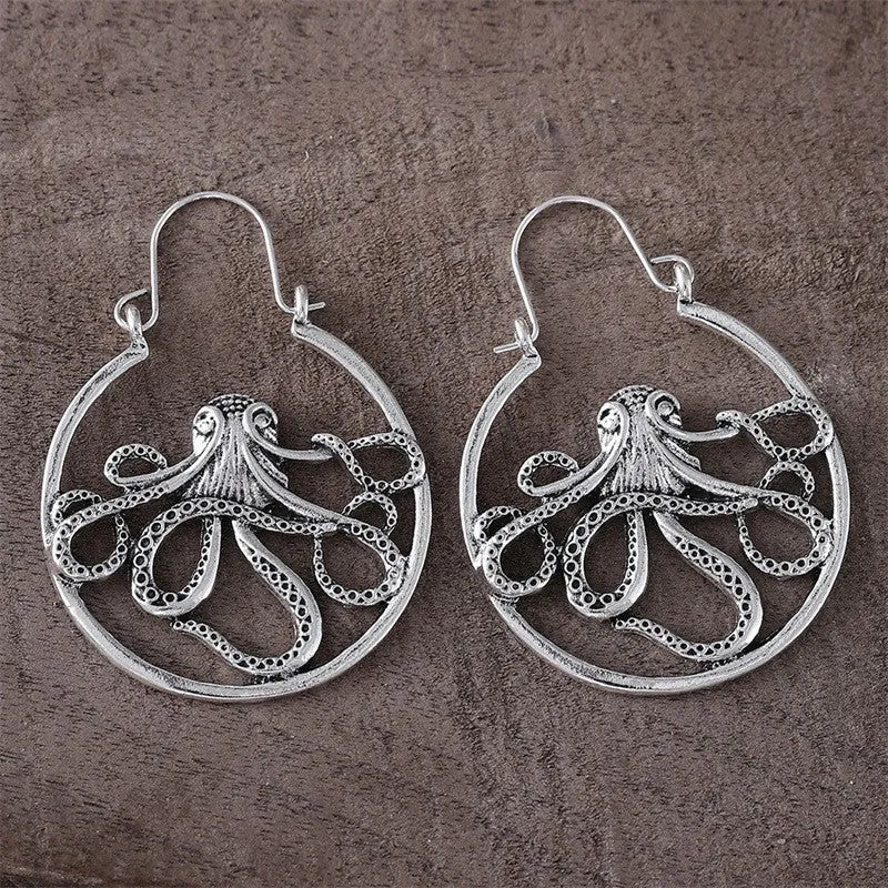 Close-up of vintage-style octopus earrings in antique silver colour with zinc alloy construction.