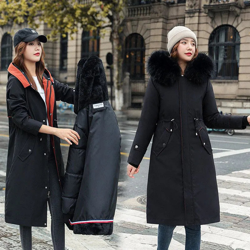 Long white women's fleece trench coat with down cotton padding on a hanger.