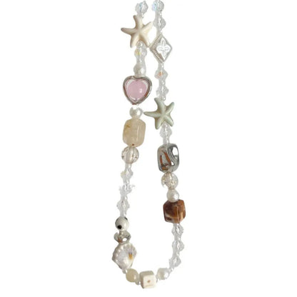 Bohemian mobile phone charm with beaded alloy design in Island Sweetheart colour on suitcase handle