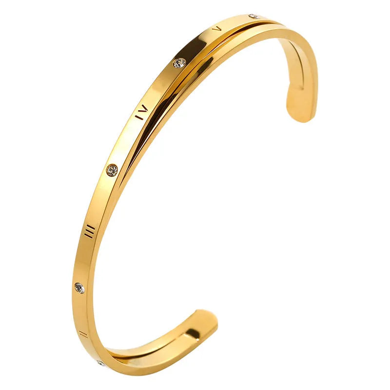 Women's open-ended stainless steel bracelet with a central inlaid zircon stone in rose gold colour.